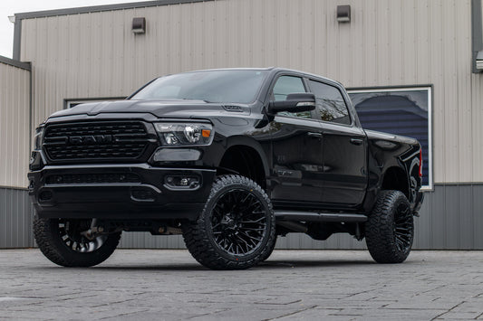 2022 Ram 1500 Big Horn with a 6" Rough Country lift kit, 22x12 Fuel Strike wheels, and 35" Fury Country Hunter R/T tires.