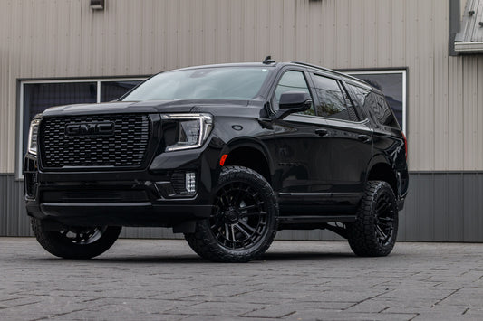 2024 GMC Yukon Denali with a 3" ReadyLift lift kit, 22x10 Fuel Heater wheels, and 295/50 Toyo Open Country AT3 tires.