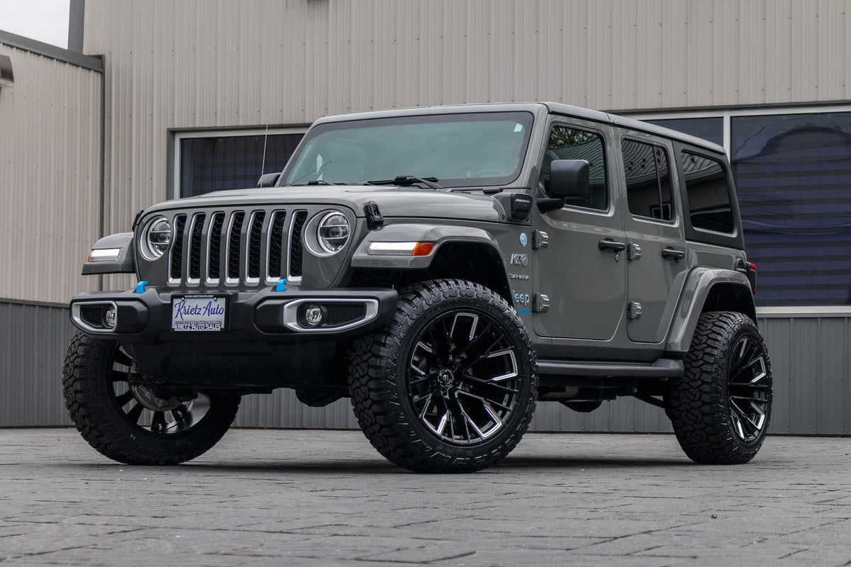 2022 Jeep Wrangler Unlimited Sahara 4XE with a 2.5" Rough Country lift kit, 22x12 Fuel Rebar wheels, and 35" Fury Country Hunter R/T tires.