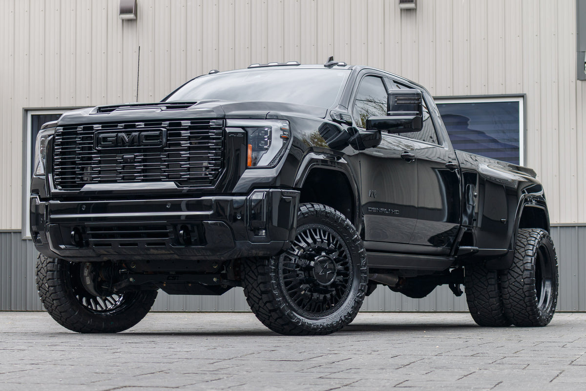 2025 GMC Sierra 3500 Denali Ultimate with a 4" CST lift kit, 24x8.25 American Force Business wheels, and 37" Nitto Ridge Grappler tires.