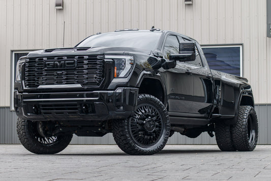 2025 GMC Sierra 3500 Denali Ultimate with a 4" CST lift kit, 24x8.25 American Force Business wheels, and 37" Nitto Ridge Grappler tires.