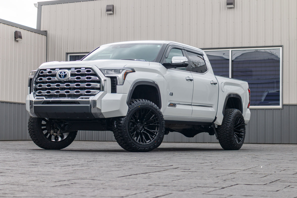 2024 Toyota Tundra Platinum with a 6" Rough Country lift kit, 22x12 Fuel Rebar wheels, and 35" Fury Country Hunter R/T tires.