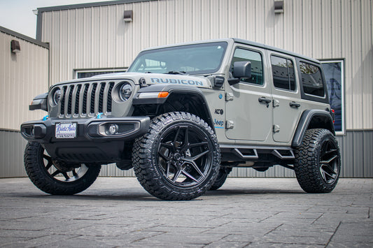 2023 Jeep Wrangler Unlimited Rubicon 4XE with Jeep Stock suspension, 22x12 Fuel Flux wheels, and 35" Fury Country Hunter R/T tires.