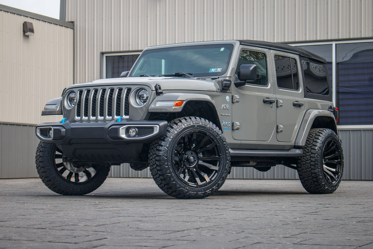 2023 Jeep Wrangler Unlimited Sahara 4XE with a 2.5" Rough Country lift kit, 22x12 Fuel Blitz wheels, and 35" Fury Country Hunter R/T tires.