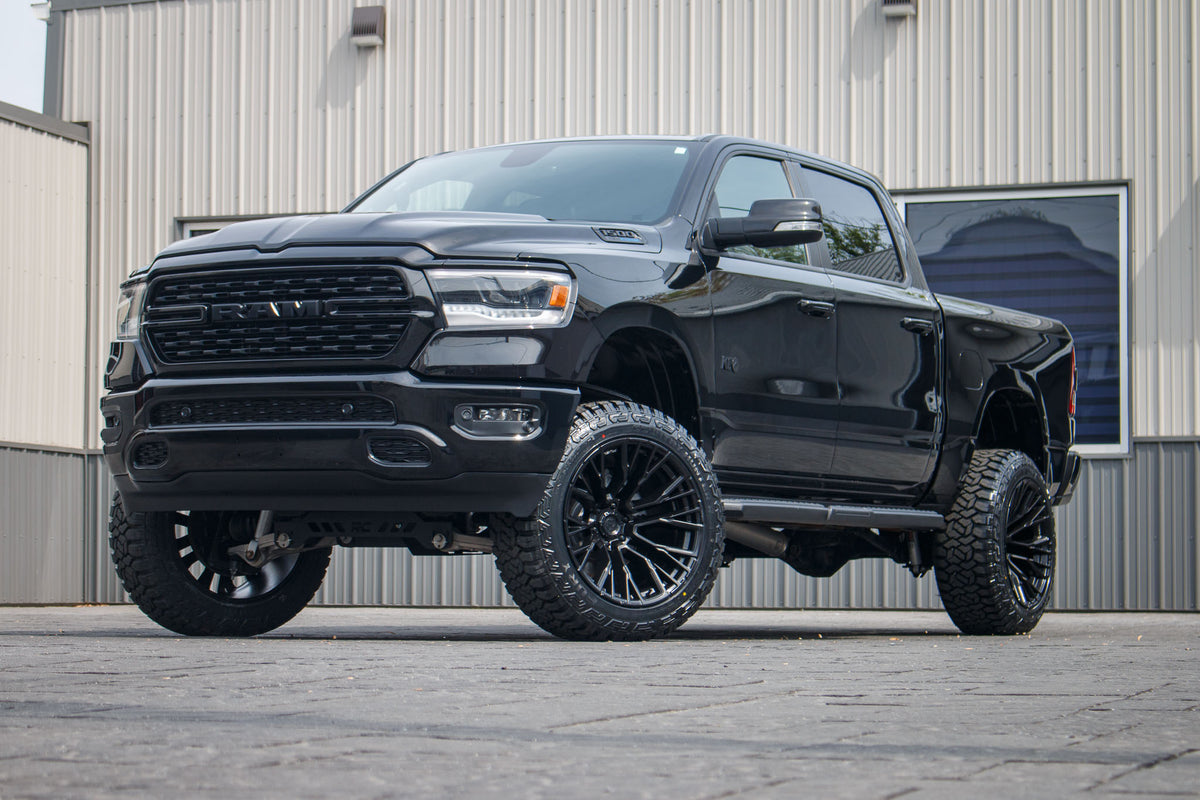 2022 Ram 1500 Big Horn with a 6" Rough Country lift kit, 22x12 Fuel Rebar wheels, and 35" Fury Country Hunter R/T tires.