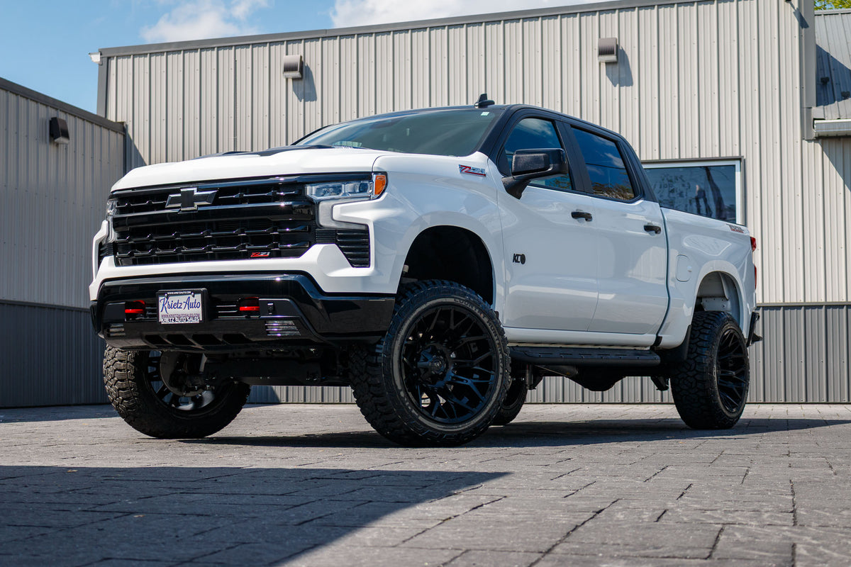2024 Chevrolet Silverado 1500 LT Trail Boss with a 6" Rough Country lift kit, 22x12 Fuel Twitch wheels, and 35" Fury Country Hunter R/T tires.