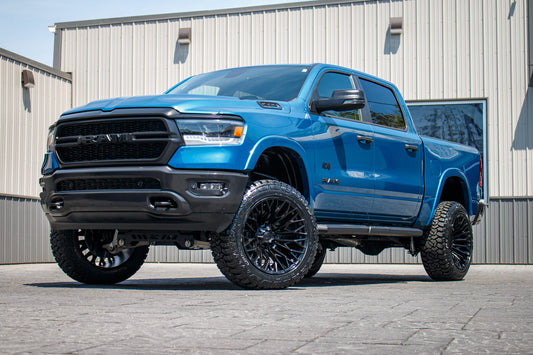 2024 Ram 1500 Lone Star with a 6" Rough Country lift kit, 22x12 Fuel Strike wheels, and Fury Country Hunter R/T tires.