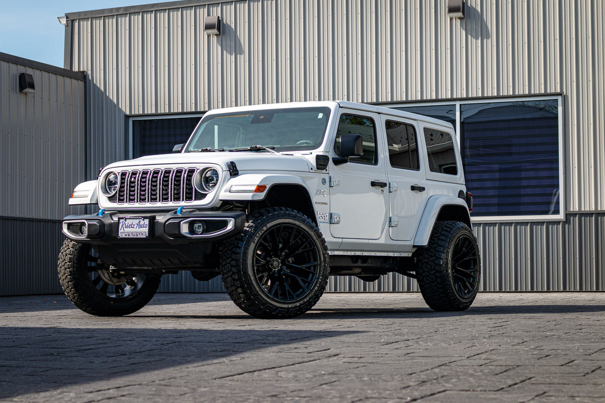 2024 Jeep Wrangler Unlimited Sahara 4XE with a 2.5" Rough Country lift kit, 22x12 Fuel Rebar wheels, and 35" Fury Country Hunter R/T