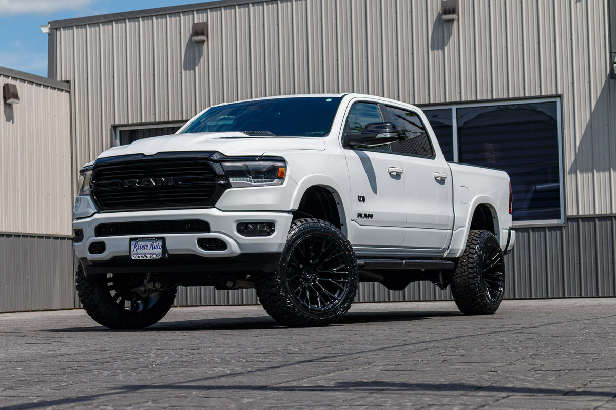 2022 Ram 1500 Laramie with a 6" Rough Country lift kit, 22x12 Fuel Rebar wheels, and 35" Fury Country Hunter R/T tires.