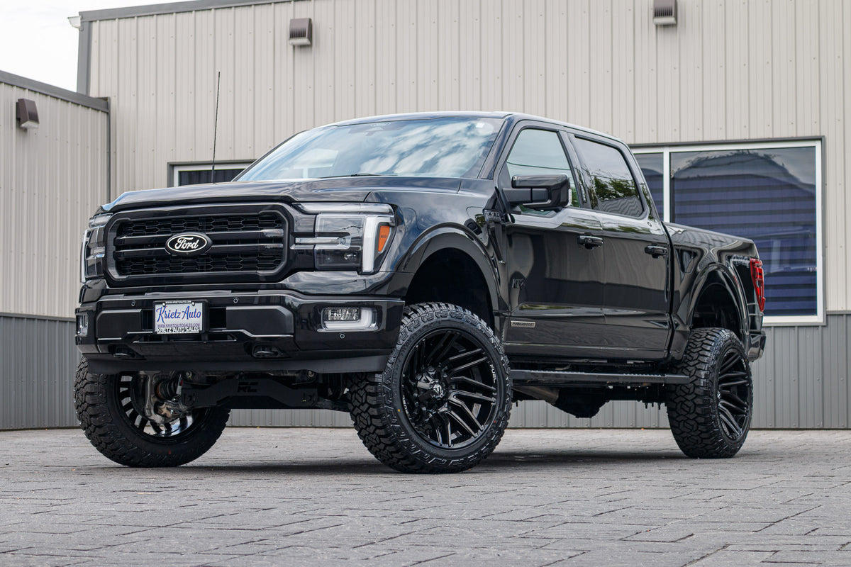 2024 Ford F-150 Lariat with a 6" Rough Country lift kit, 22x12 Fuel Typhoon wheels, and 35" Fury Country Hunter R/T tires.