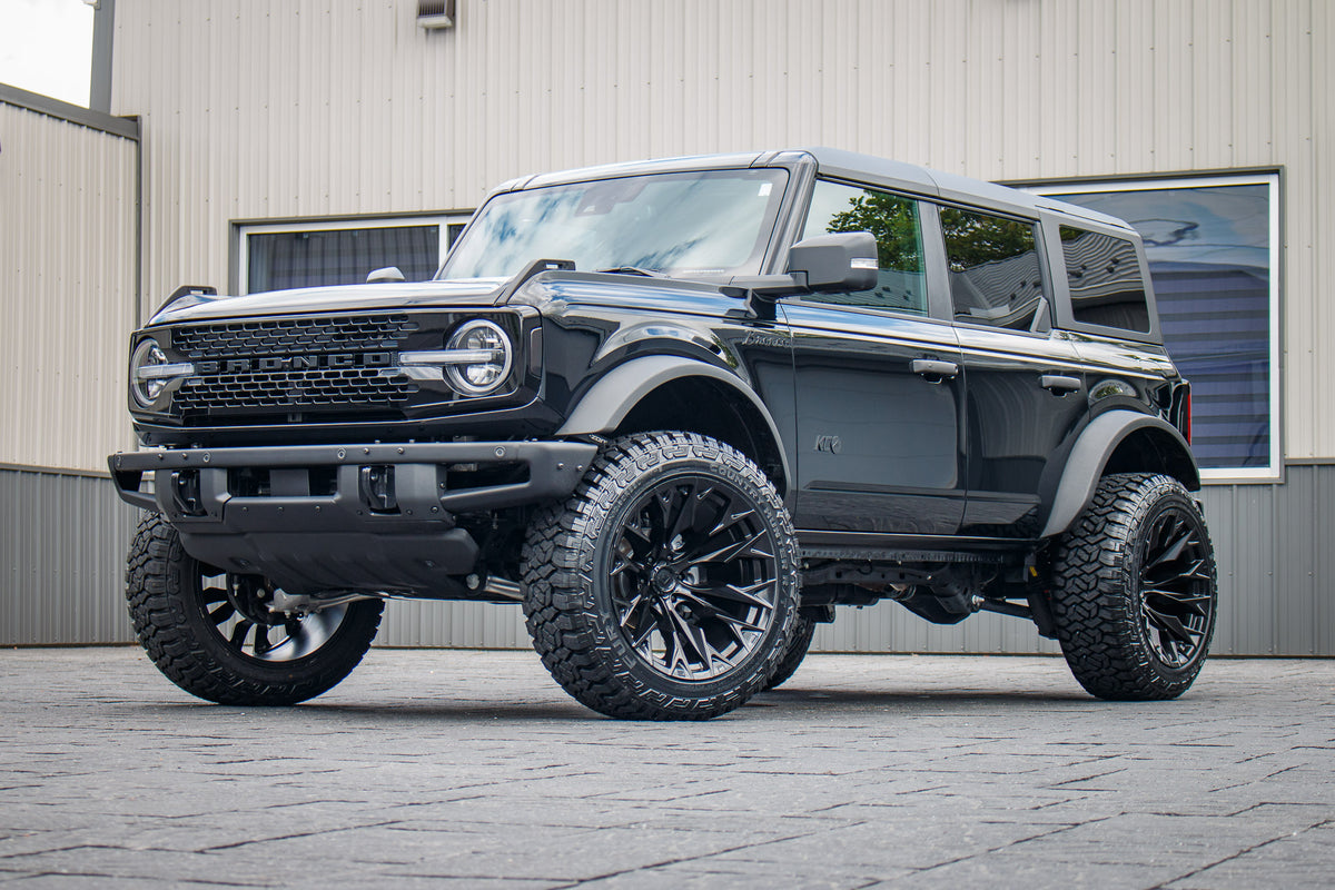 2024 Ford Bronco Wildtrak with a 2.25" Zone lift kit, 22x12 Fuel Flame wheels, and 35" Fury Country Hunter R/T tires.