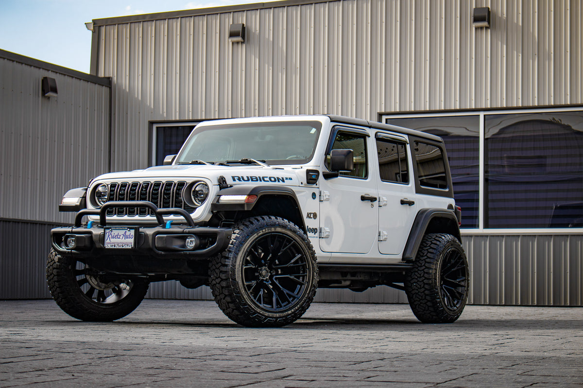 2023 Jeep Wrangler Unlimited Rubicon 4XE with Jeep Stock suspension, 22x12 Fuel Rebar wheels, and 35" Fury Country Hunter R/T tires.