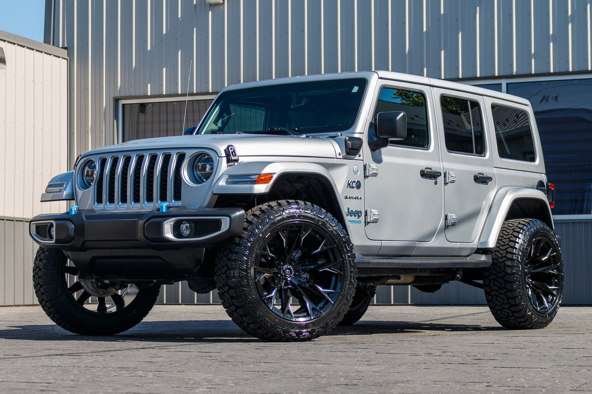 2022 Jeep Wrangler Unlimited Sahara 4XE with a 2.5" Rough Country lift kit, 22x12 Fuel Flame wheels, and 35" Fury Country Hunter R/T tires.