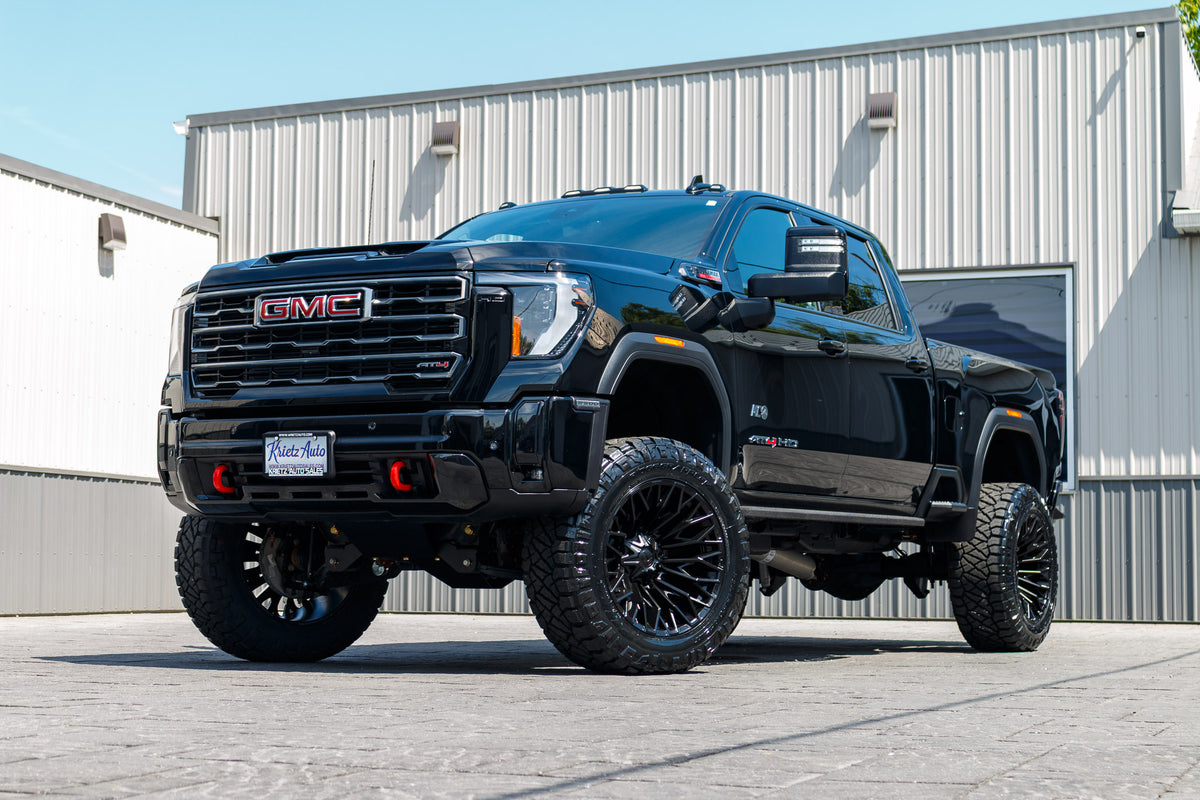 2025 GMC Sierra 2500 AT4 with a 5" BDS lift kit, 22x12 Fuel Strike wheels, and 37" Nitto Ridge Grappler tires.