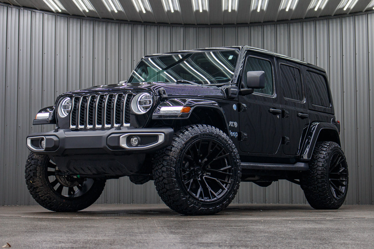 2021 Jeep Wrangler Unlimited Sahara 4XE with a 2.5" Rough Country lift kit, 22x12 Fuel Rebar wheels, and 35" Fury Country Hunter R/T tires.