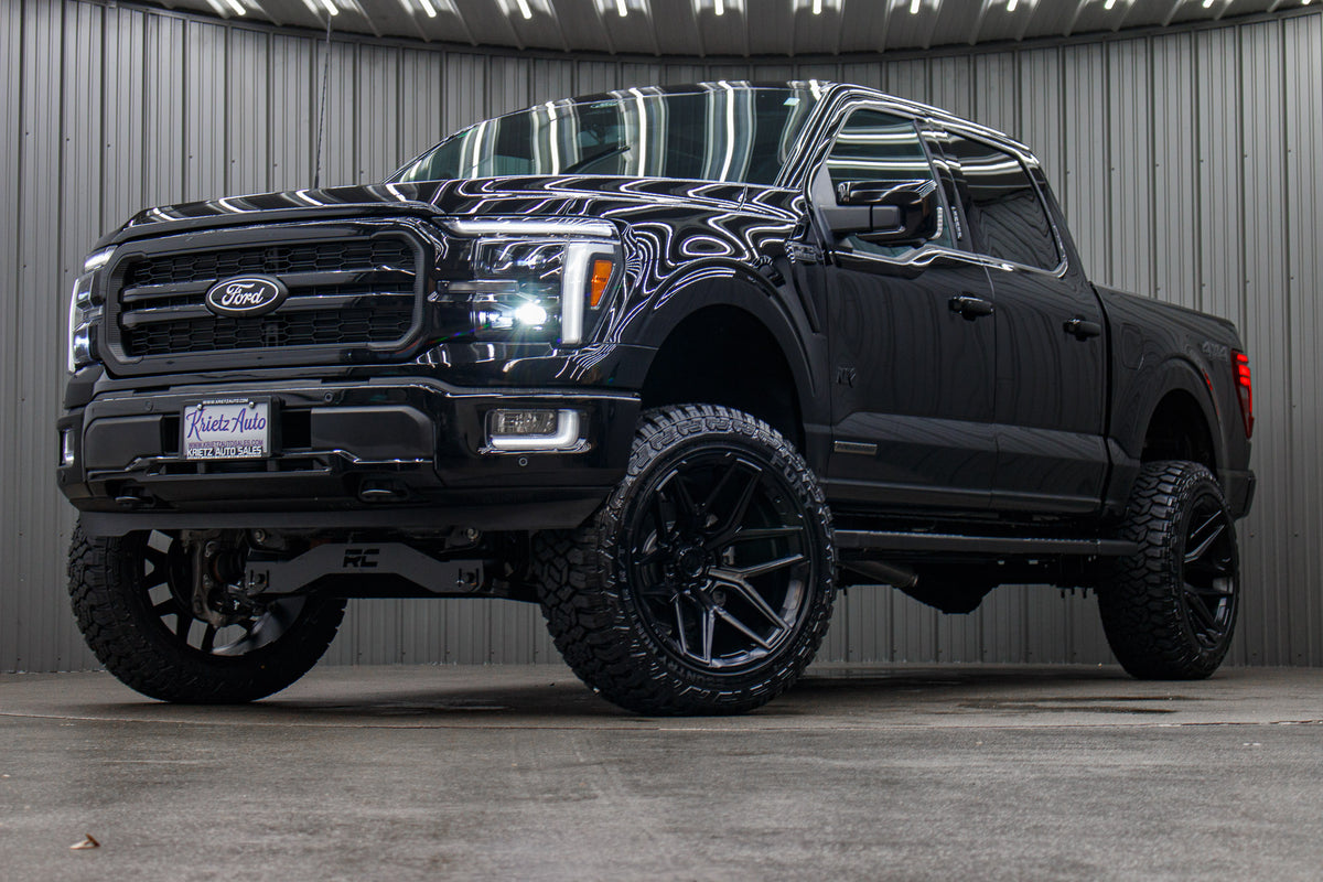 2024 Ford F-150 Lariat with a 6" Rough Country lift kit, 22x12 Fuel Flux wheels, and 35" Fury Country Hunter R/T tires.