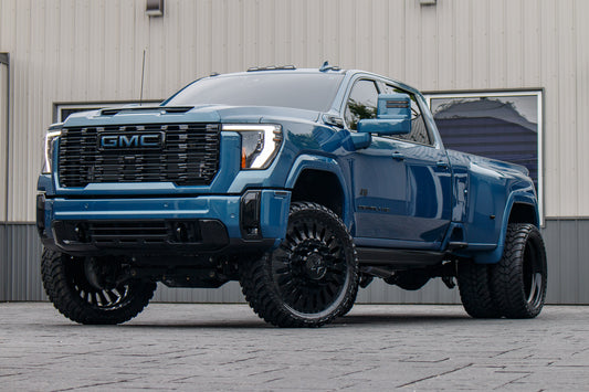 2025 GMC Sierra 3500 Denali Ultimate with a 4" CST lift kit, 26x8.25 American Force Massive wheels, and 37" AMP Terrain Attack M/T A tires.