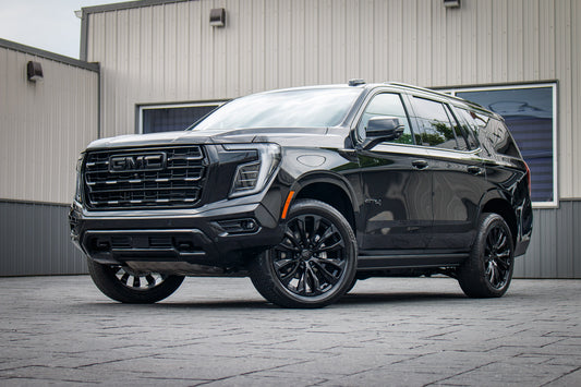 2025 GMC Yukon AT4 Ultimate with GMC Factory suspension, 22x9 GMC Stock wheels, and 275/50 Bridgestone Alenza tires.