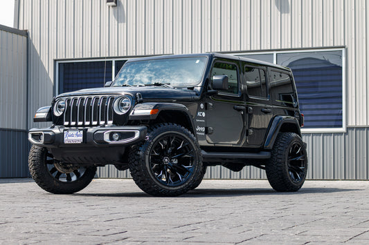 2022 Jeep Wrangler Unlimited Sahara Altitude with a 2.5" Rough Country lift kit, 22x12 Fuel Flame wheels, and 35" Fury Country Hunter R/T tires.