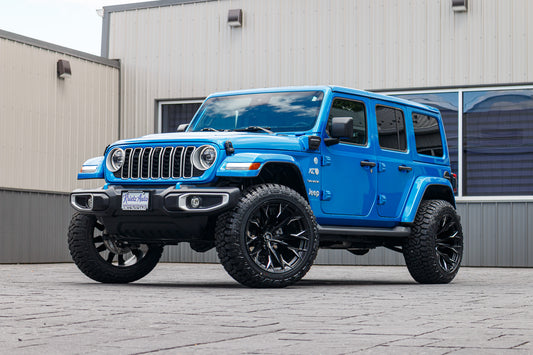 2024 Jeep Wrangler Unlimited Sahara 4XE with a 2.5" Rough Country lift kit, 22x12 Fuel Flame wheels, and 35" Fury Country Hunter R/T tires.