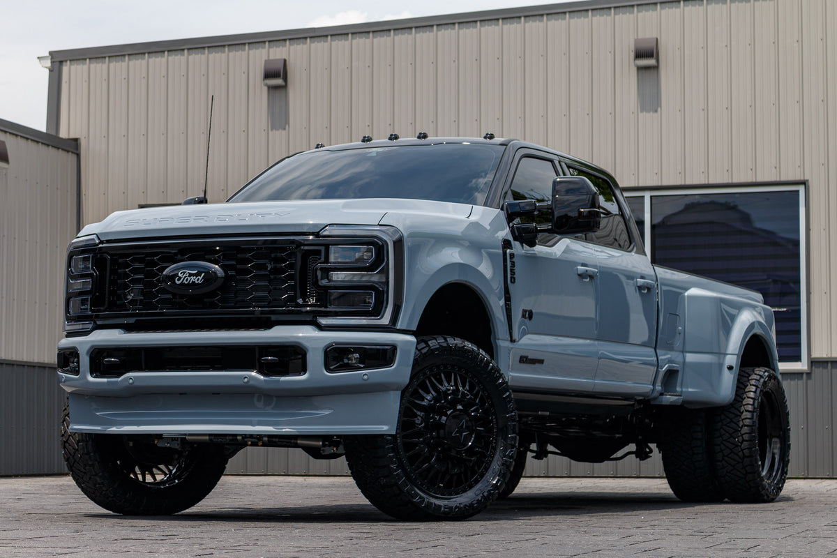 2025 Ford F-350 XL with a 4" Wicked lift kit, 24x8.25 American Force Plague wheels, and 37" Nitto Ridge Grappler tires.