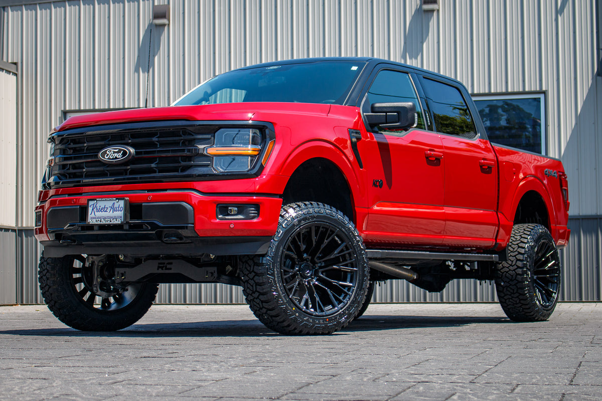 2024 F-150 XLT with a 6" Rough Country lift kit, 22x12 Fuel Rebar wheels, and Fury Country Hunter R/T tires.