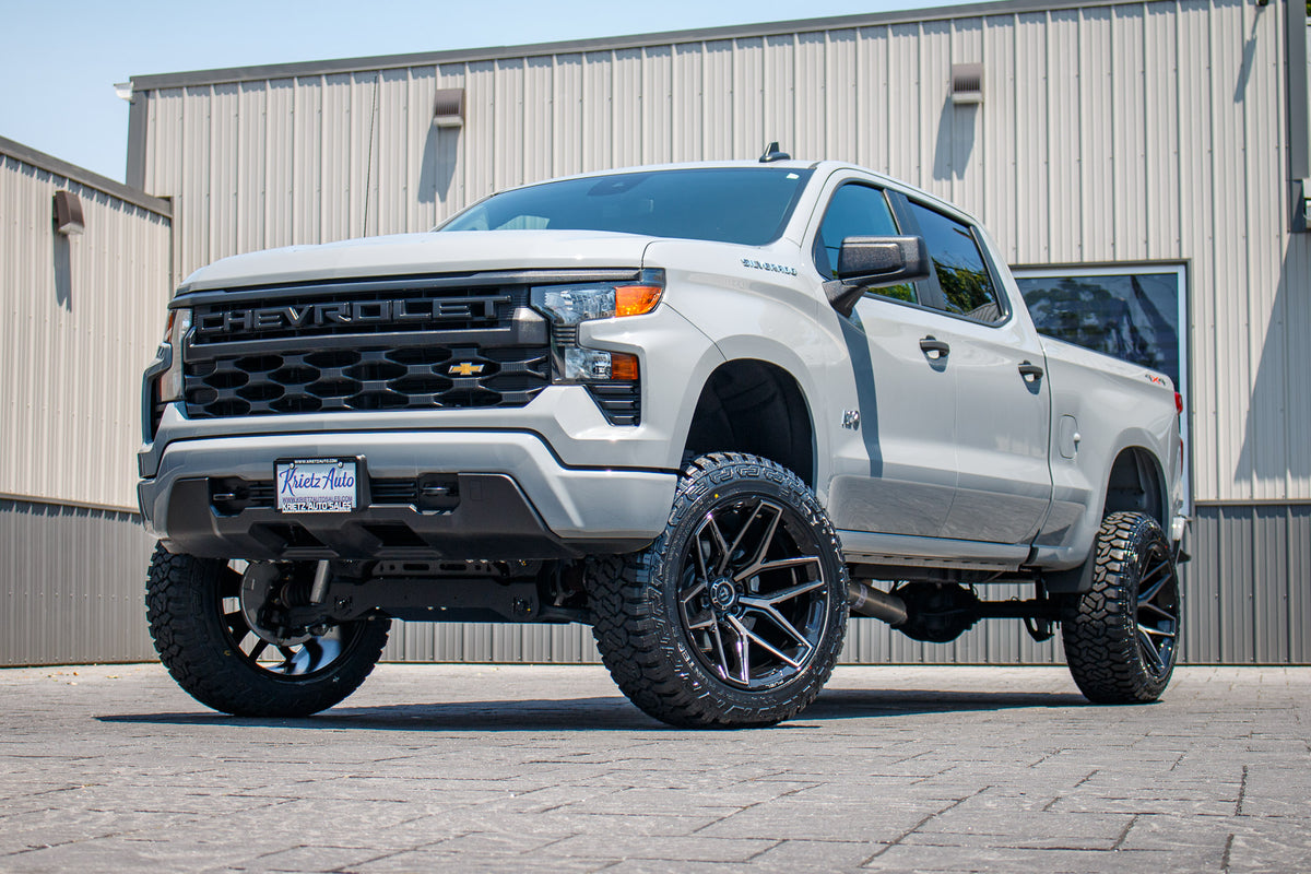 2024 Chevrolet Silverado 1500 Custom with a 6" Rough Country lift kit, 22x12 Fuel Flux wheels, and 35" Fury Country Hunter R/T tires.