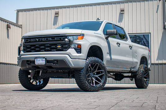 2024 Chevrolet Silverado 1500 Custom with a 6" Rough Country lift kit, 22x12 Fuel Flux wheels, and 35" Fury Country Hunter R/T tires.