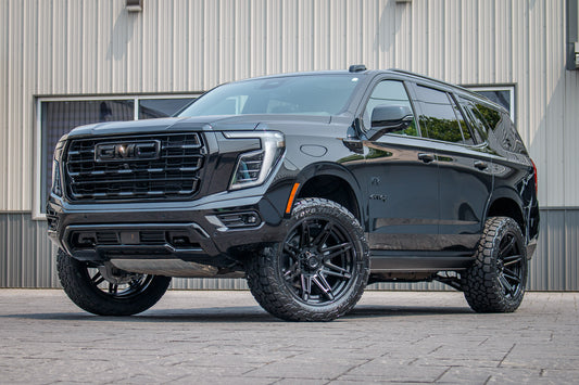 2025 GMC Yukon AT4 Ultimate with a 2" Rough Country lift kit, 22x10 Fuel Brawl wheels, and 295/50 Toyo Open Country A/T III tires.