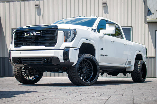 2025 GMC Sierra 2500 AT4 with a 3" Cognito leveling kit, 24x14 American Force Frost wheels. and 33" Fury Country Hunter M/T tires.