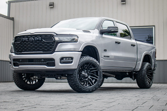 2025 Ram 1500 Lone Star with a 6" Rough Country lift kit, 22x12 Fuel Typhoon wheels, and 35" Fury Country Hunter R/T tires.