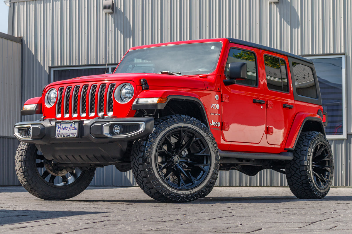 2021 Red Jeep Wrangler Unlimited Sahara Altitude with a 2.5 inch rough country lift kit, 22x12 Fuel Flame Wheels and 35 inch nitto ridge grappler tires.