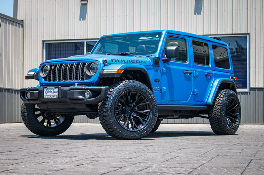 2024 Jeep Wrangler Unlimited Rubicon 4XE with Jeep Stock suspension, 22x12 Fuel Rebar wheels, and 35" Fury Country Hunter tires.