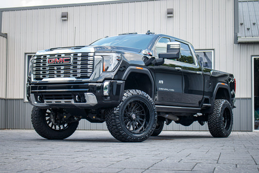 2025 GMC Sierra 2500 Denali with a 5" BDS lift kit, 22x12 TIS 547B wheels, and 37" Nitto Ridge Grappler tires.