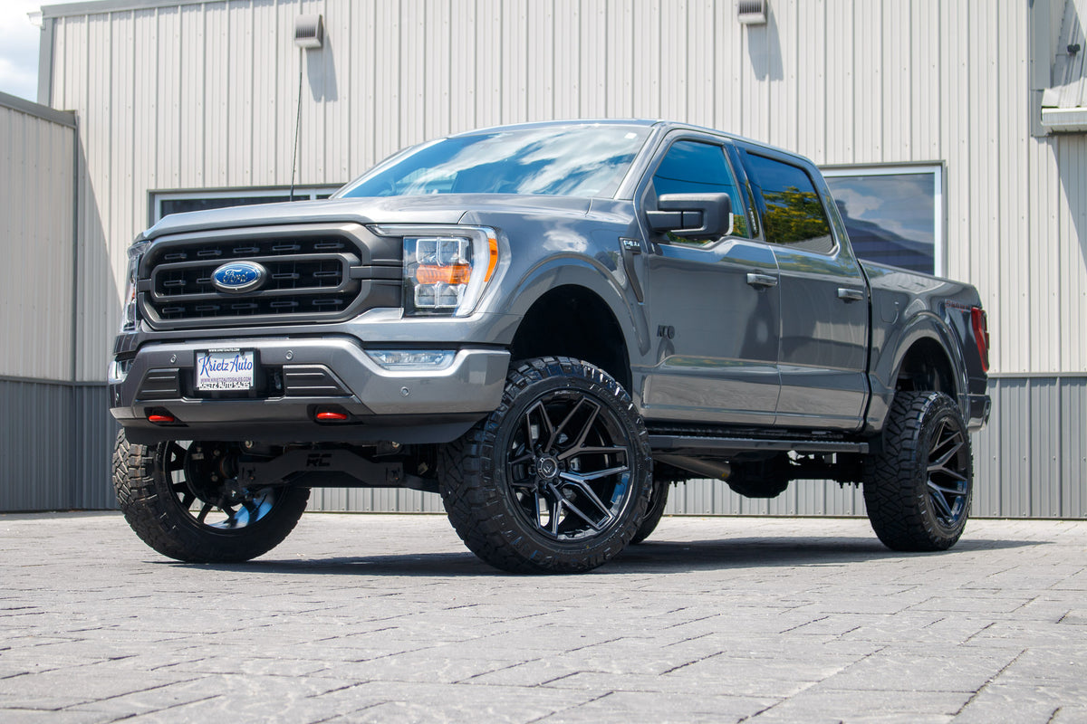 2023 Ford F-150 XLT Gray woth 6 inch Rough Country lift kit and 22x12 Fuel Flux wheels and 35 inch Nitto Ridge Grappler Tires