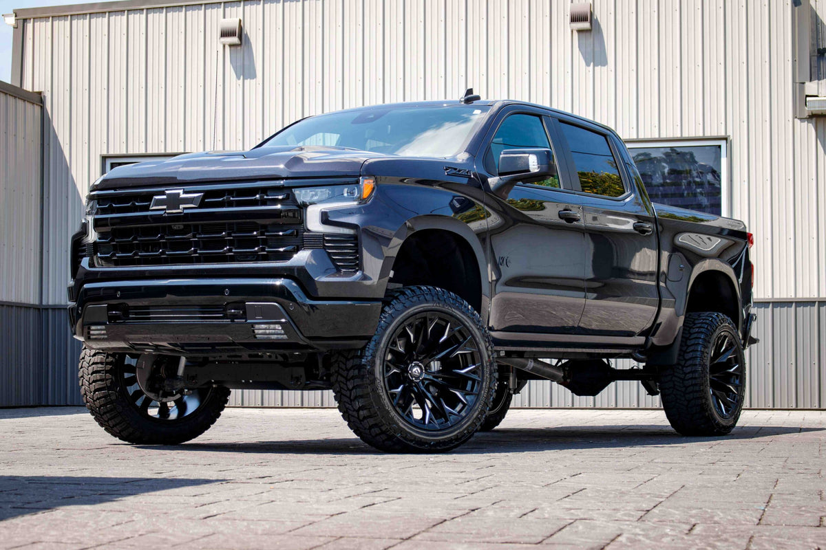 2024 Chevrolet Silverado 1500 LT Trail Boss with a 6" Rough Country lift kit, 22x12 Fuel Flame wheels, and 35" Avix Trailtek tires.