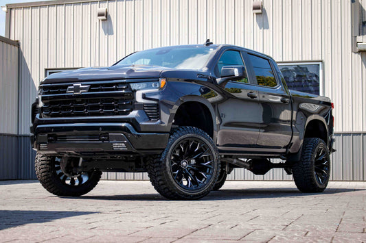 2024 Chevrolet Silverado 1500 LT Trail Boss with a 6" Rough Country lift kit, 22x12 Fuel Flame wheels, and 35" Avix Trailtek tires.