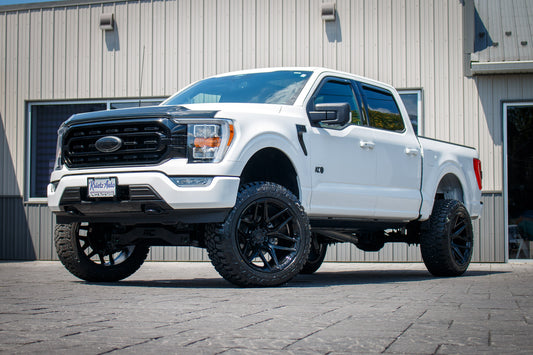 2022 Ford F-150 XLT with a 6" Rough Country lift kit, 22x12 Fuel Flux wheels, and 35" Fury Country Hunter R/T tires.