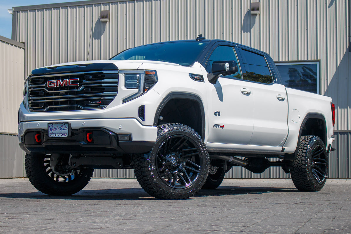 2025 GMC Sierra 1500 AT4 with a 6" Rough Country lift kit, 22x12 Fuel Typhoon wheels, and 35" Fury Country Hunter R/T tires.