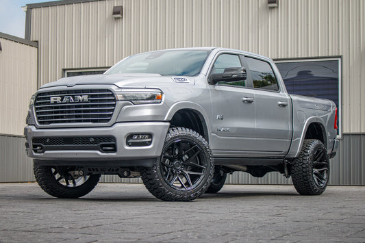 2025 Ram 1500 Laramie with a 6" Rough Country lift kit, 22x12 Fuel Flux wheels, and 35" Fury Country Hunter R/T tires.