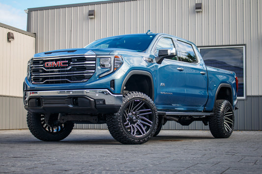 2024 GMC Sierra 1500 SLT with a 6" Rough Country lift kit, 22x12 Fuel Typhoon wheels and 35" Fury Country Hunter R/T tires.