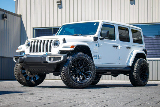 2022 Jeep Wrangler Unlimited Sahara 4XE with a 2.5" Rough Country lift kit, 22x12 Fuel Rebar wheels, and 35" Fury Country Hunter R/T tires.