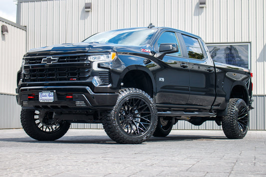 2024 Chevrolet Silverado 1500 LT Trail Boss with a 6" Rough Country lift kit, 22x12 TIS 566B wheels, and 35" Fury Country Hunter R/T tires.