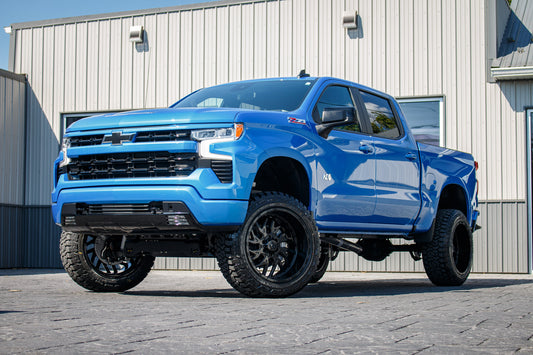 2025 Chevrolet Silverado 1500 RST with a 6" Rough Country lift kit, 22x12 TIS 544B wheels, and 35" Fury Country Hunter R/T tires.