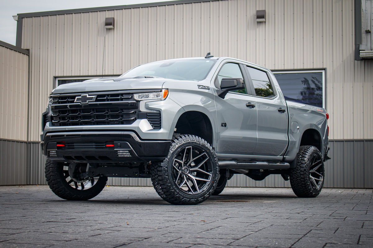 2025 Chevrolet Silverado 1500 LT Trail Boss with a 6" Rough Country lift kit, 22x12 Fuel Flux wheels, and 35" Fury Country Hunter R/T tires.