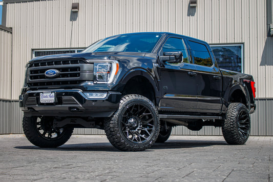 2022 Ford F-150 Lariat with a 6" Rough Country lift kit, 22x12 Fuel Twitch wheels, and 35" Fury Country Hunter R/T tires.