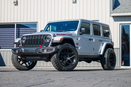 2022 Jeep Wrangler Unlimited Rubicon with Jeep Stock suspension, 22x12 Fuel Flux wheels, and 35" Fury Country Hunter R/T tires.