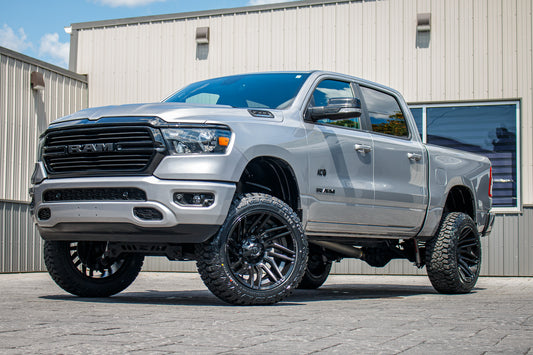 2021 Ram 1500 Big Horn with a 6" Rough Country lift kit, 22x12 Fuel Typhoon wheels, and 35" Fury Country Hunter R/T tires.