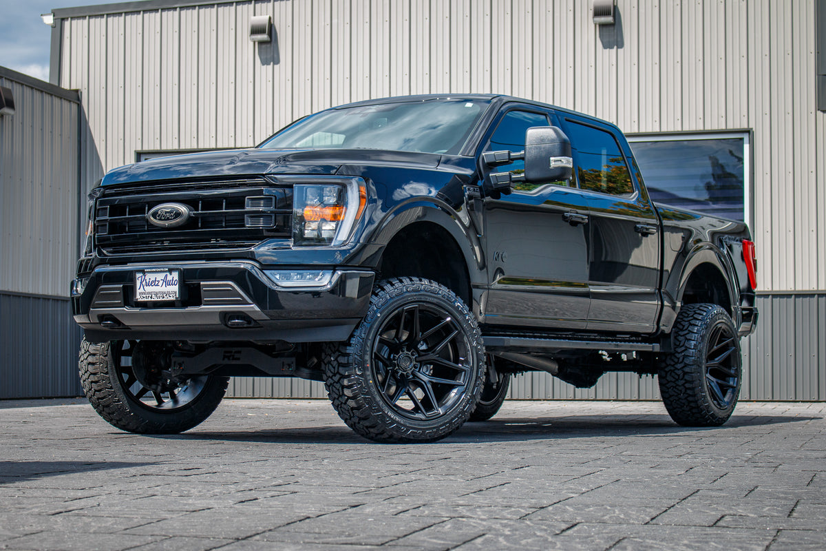 2023 Ford F-150 XLT with a 6" Rough Country lift kit, 22x12 Fuel Flux wheels, and 35" Fury Country Hunter R/T tires.