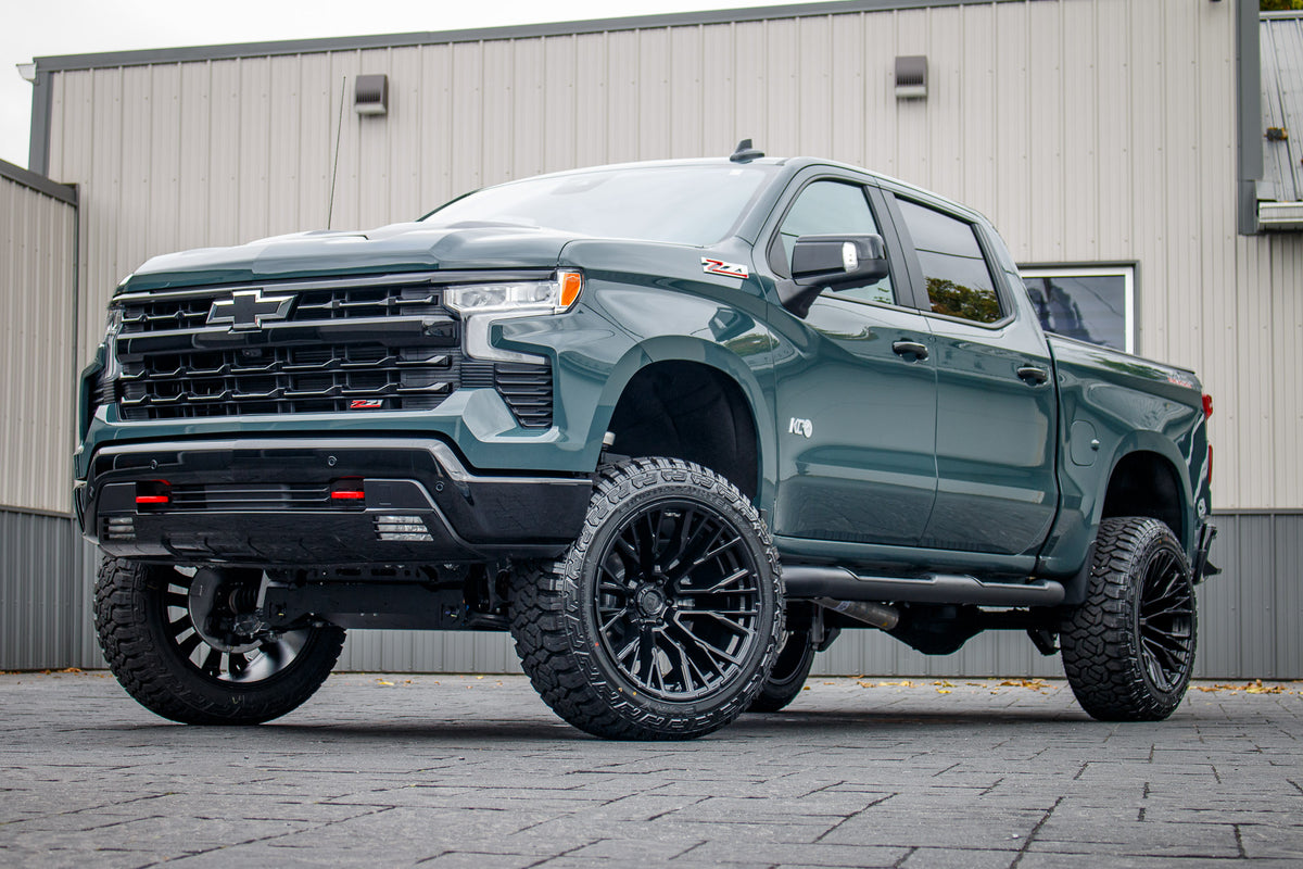 2025 Chevrolet Silverado 1500 LT Trail Boss with a 6" Rough Country lift kit, 22x12 Fuel Rebar wheels, and 35" Avix Trailtek R/T tires.